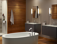 Decorative circular white bathtub in the foreground with two bathroom sinks in the background.